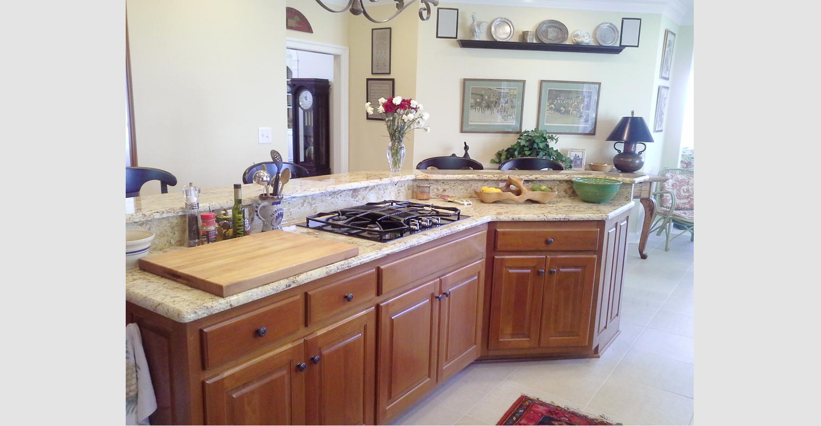 remodeled kitchen with chefs island and marble countertops